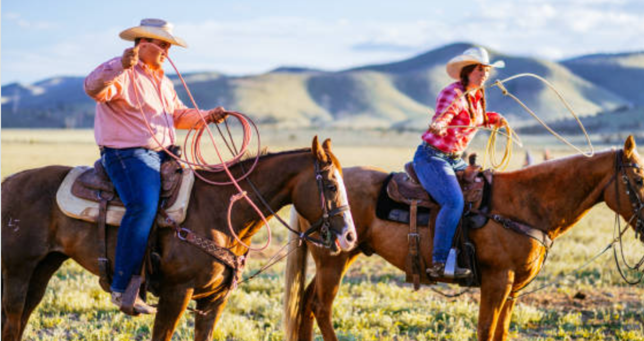 man_and_woman_on_horseback_roping_with_western_horse_tack_breast_collar_sets_and_saddles