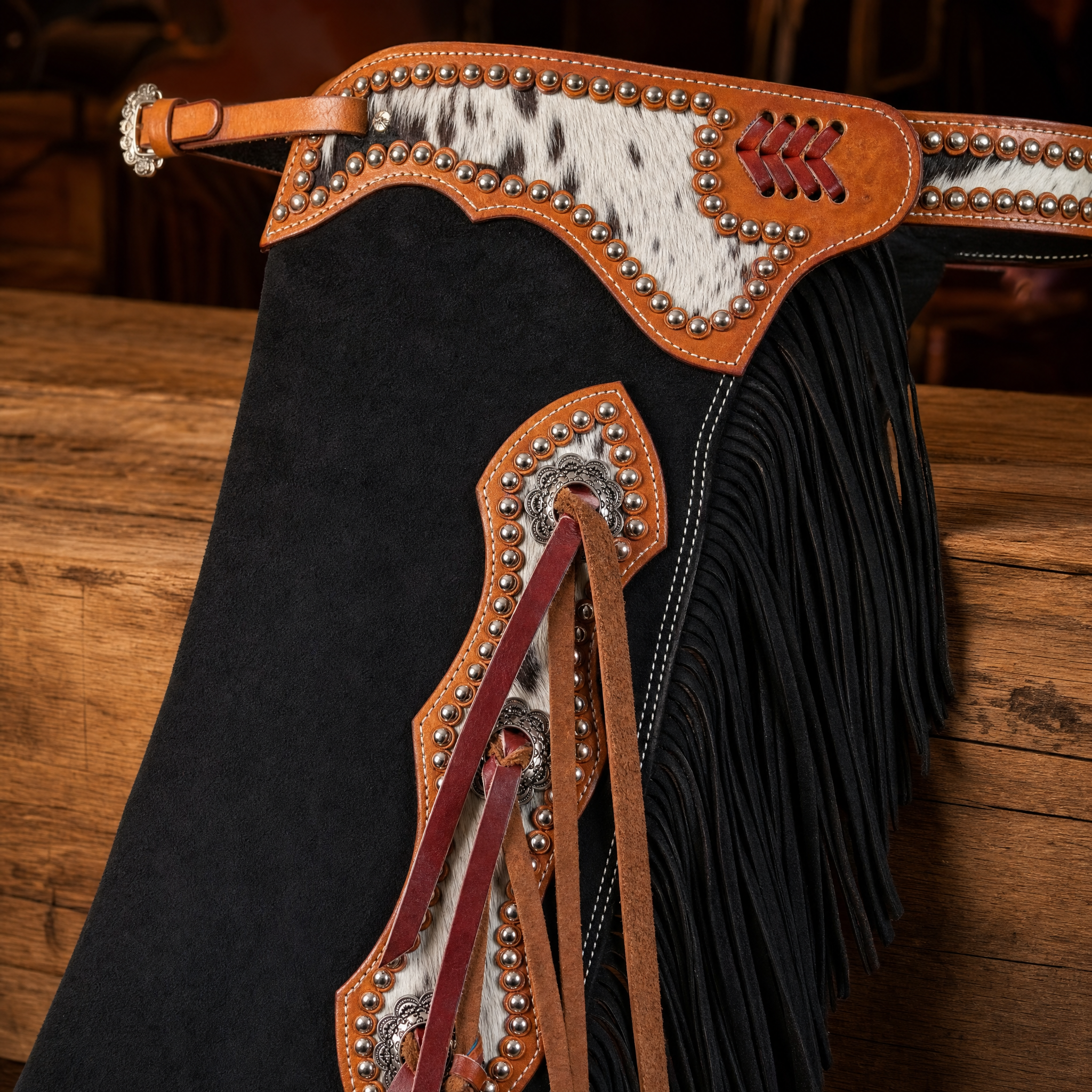 Showman Cowpuncher Black Chinks close-up detail showing leather fringe trim and hardware