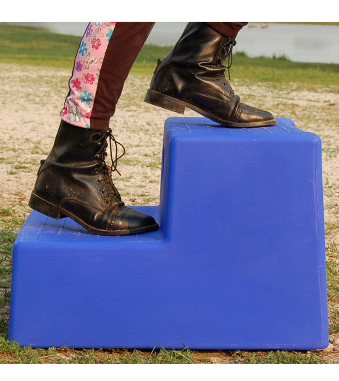 woman using 2 step equestrian navy mounting block