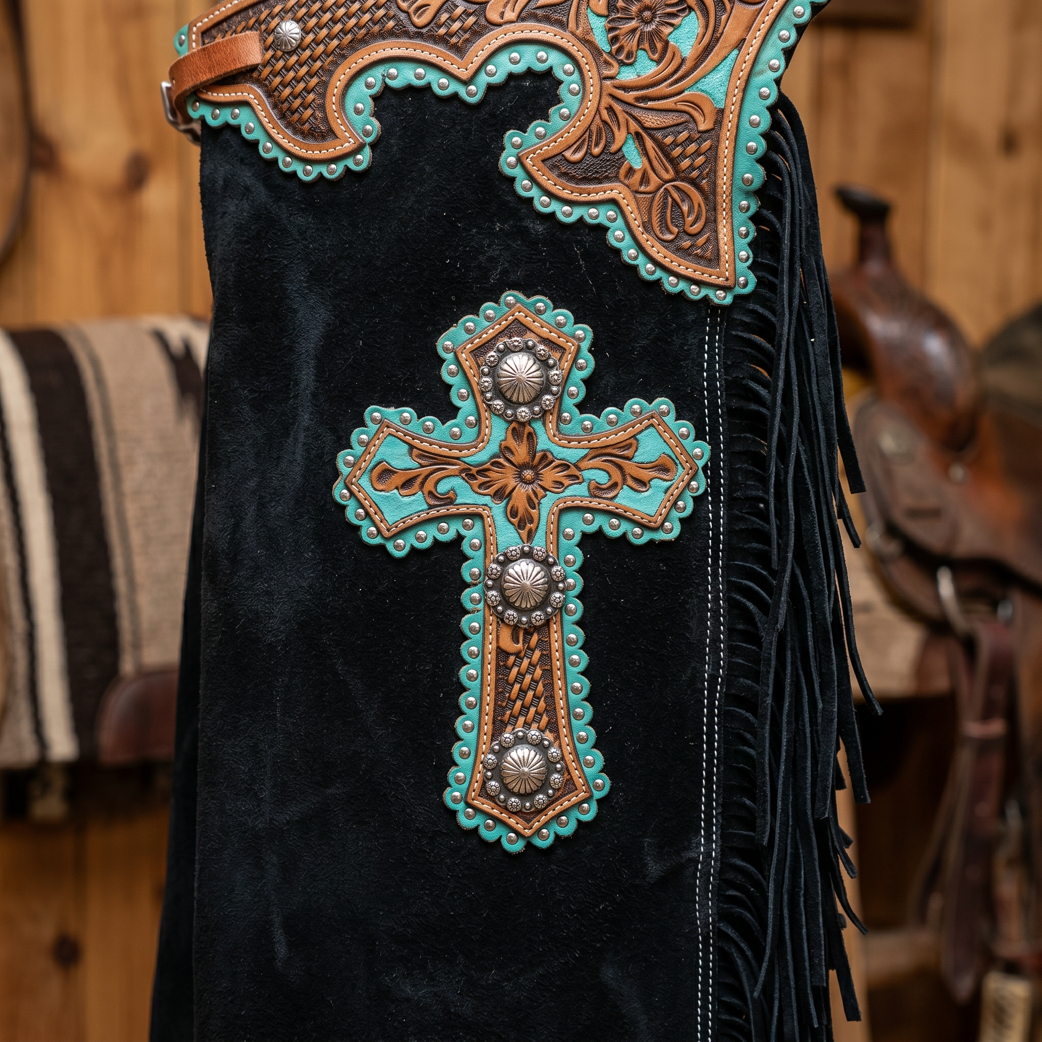 Showman Black Suede Chinks with Cross Design close-up detail showing tooling fringe and hardware