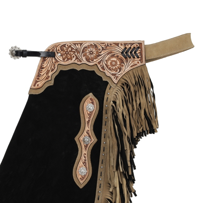 Showman Desert Noir Chinks detail view with western leather tooling fringe and hardware