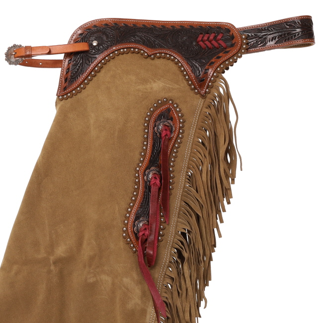 Showman Sandstone Chinks detail view with western leather tooling fringe and hardware